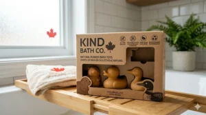 A photorealistic illustration of West Coast maritime-themed natural rubber bath toys, including a sea otter and a boat marked 'Vancouver', floating near a frosted window.