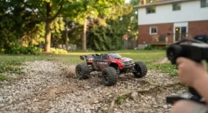 Remote control off-road buggy driving over gravel and light dirt paths.