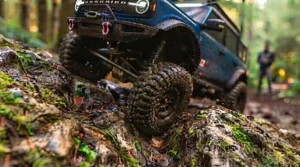 Hobbyist controlling an off-road RC truck in a park.